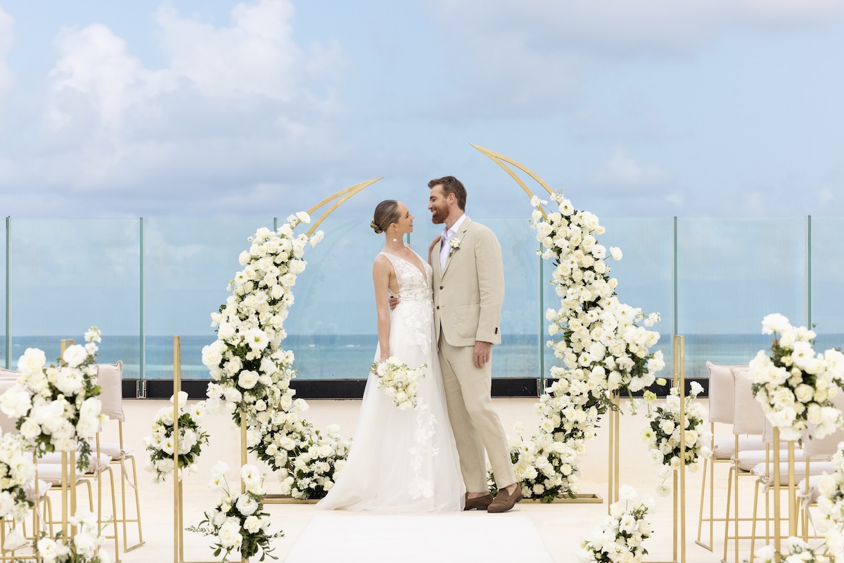 Bride and groom at altar with Golden Wedding Decor at AVA Resort Cancun